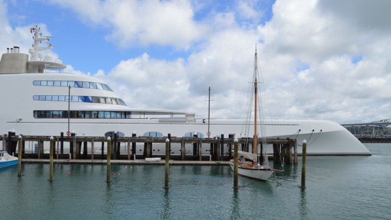 a boat is docked next to a body of water