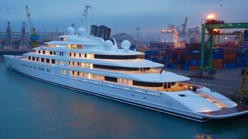 a boat is docked next to a body of water