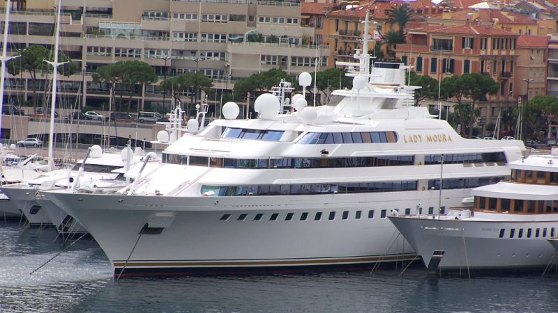 a boat is docked next to a body of water